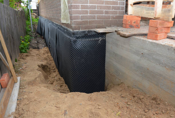SJ Waterproofing Pros technician performing targeted Waterproofing assessment in Tipton, MI